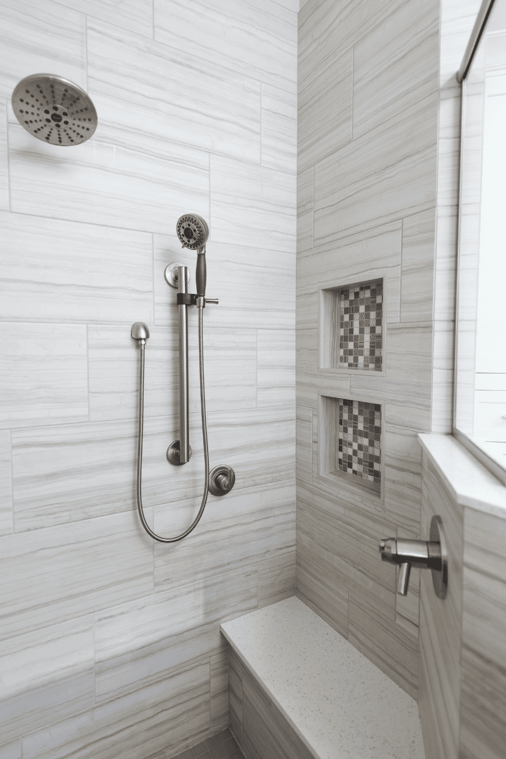 Nicholas Design Build | A black and white photo capturing a bathroom remodel with a shower.