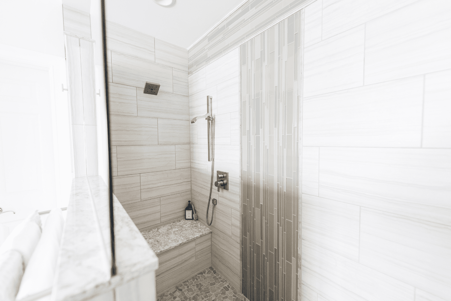 Nicholas Design Build | A black and white photo of a shower in a master bathroom.