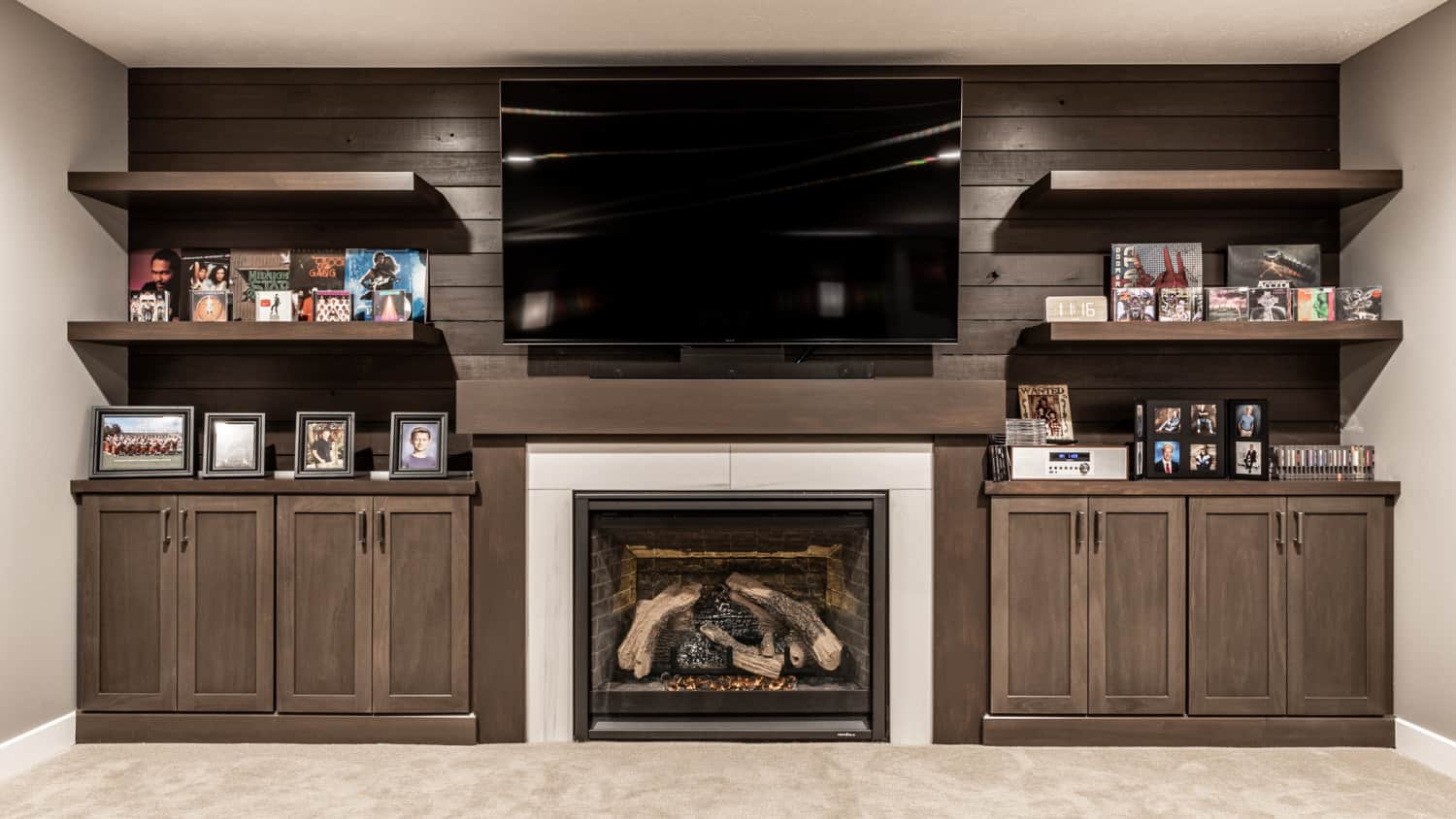 Nicholas Design Build | A living room with a fireplace and tv.