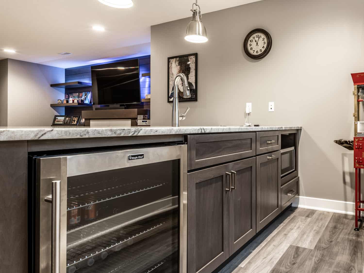 Nicholas Design Build | A kitchen with a refrigerator and a bar area.