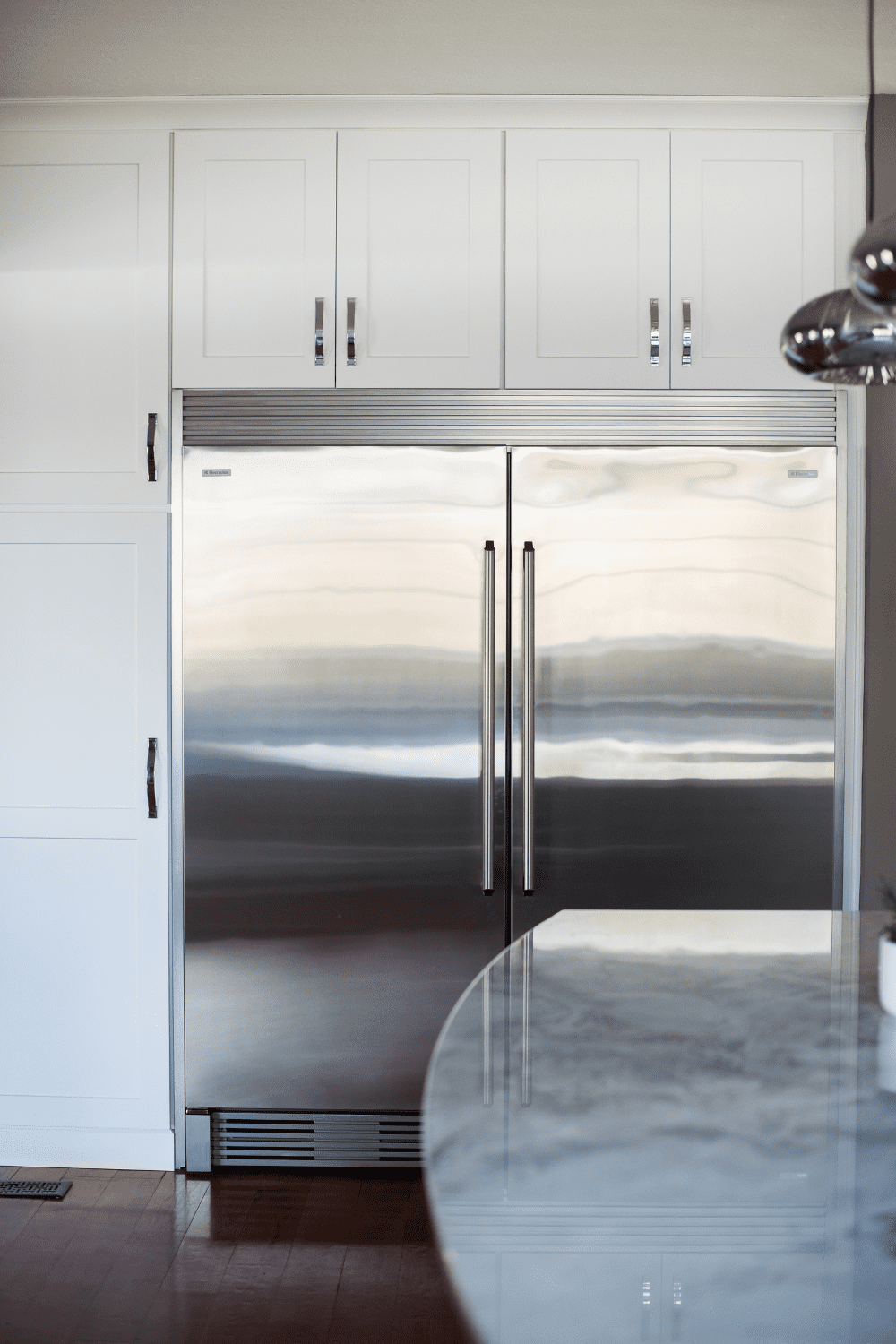 Nicholas Design Build | A stainless steel refrigerator in a kitchen.