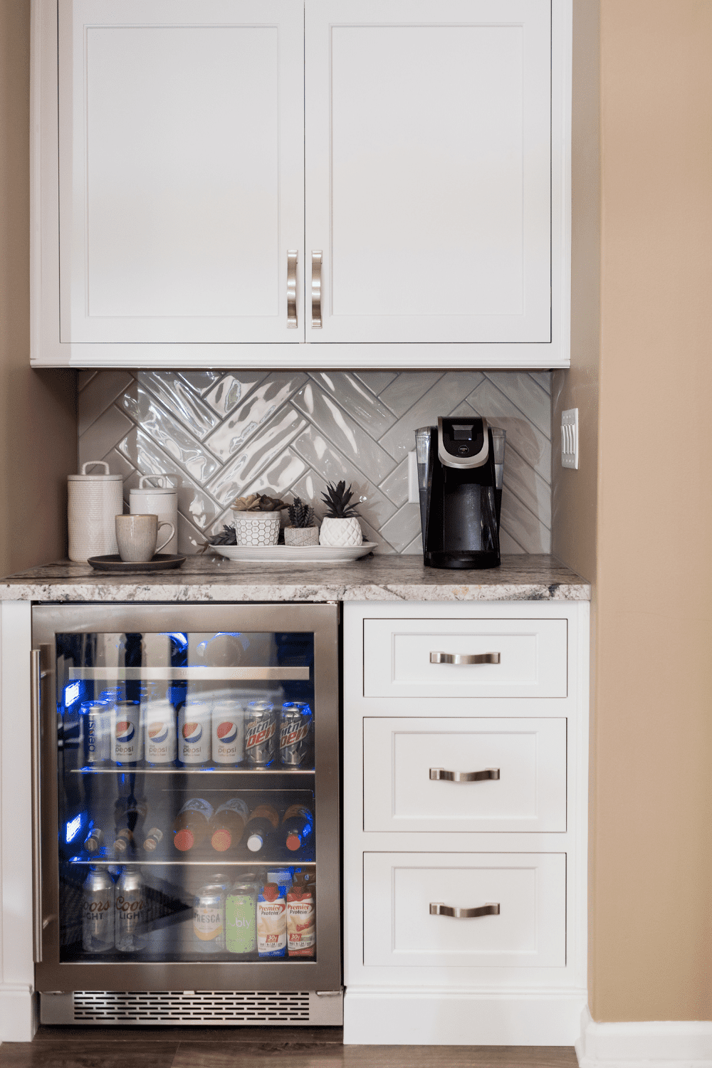 Nicholas Design Build | A versatile kitchen with a refrigerator in white cabinets.