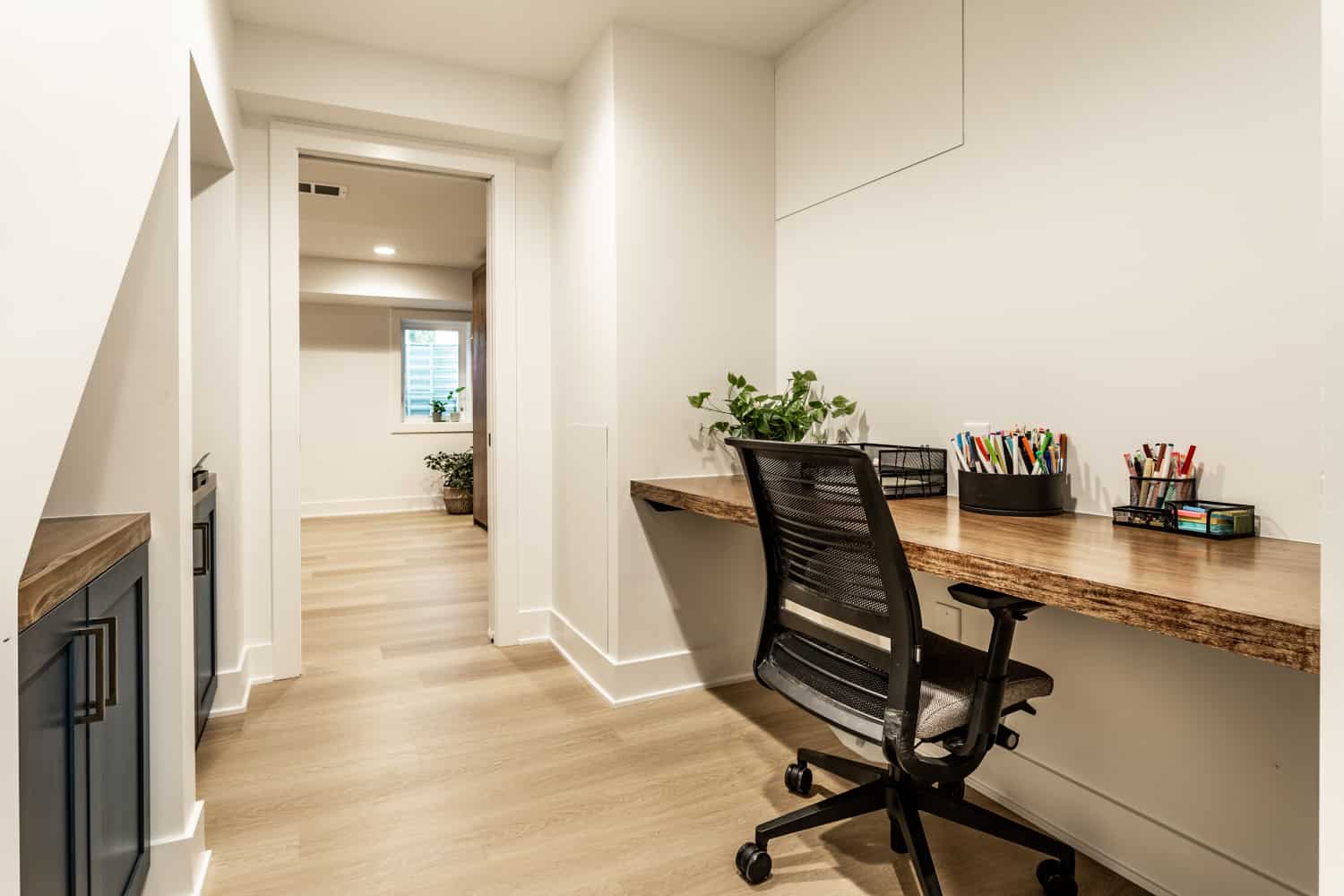 Nicholas Design Build | A remodeled home office with a desk and chair.