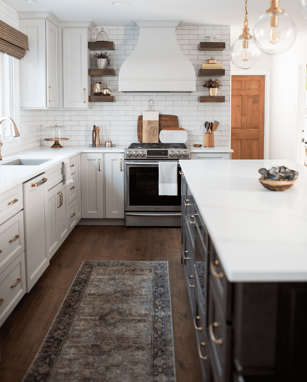 Nicholas Design Build | A neutral kitchen with a rug on the floor.