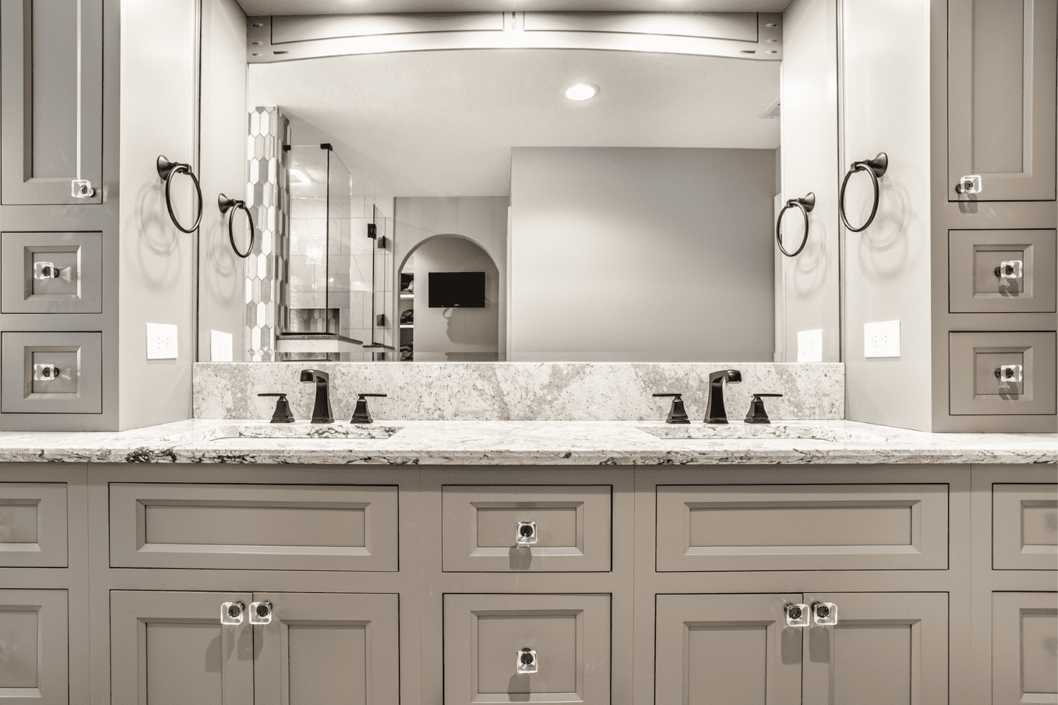 Nicholas Design Build | A bathroom with two sinks and a mirror.