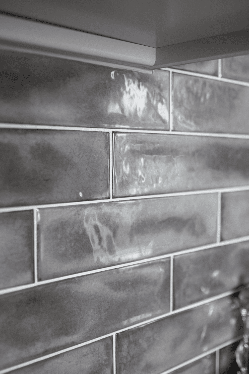 Nicholas Design Build | A black and white photo of a tiled wall.