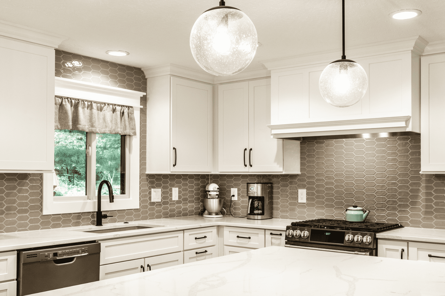 Nicholas Design Build | A neutral black and white photo of a kitchen.