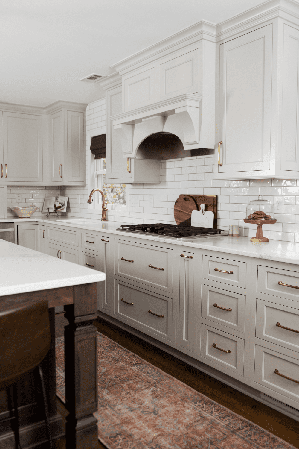 Nicholas Design Build | A kitchen with white cabinets.