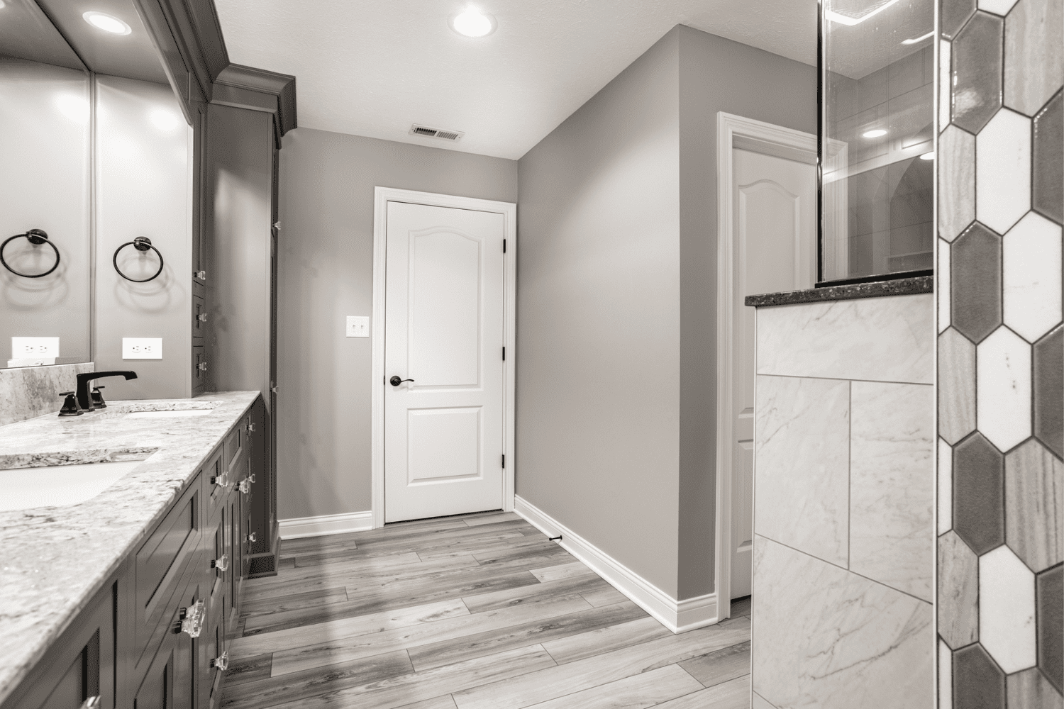 Nicholas Design Build | A black and white photo of a bathroom.