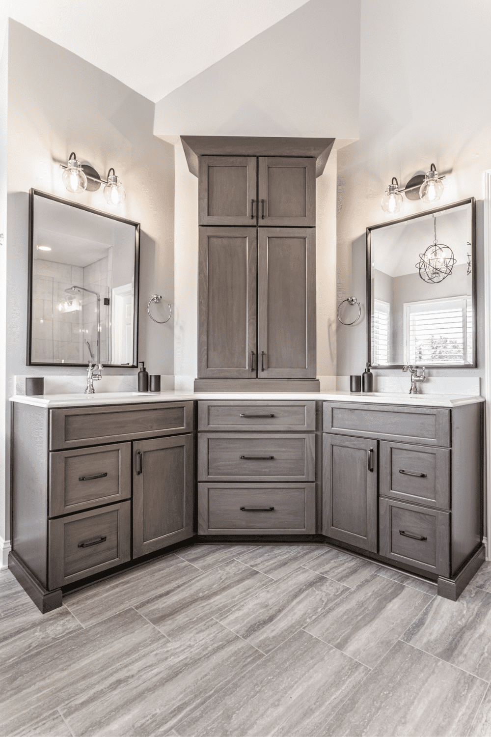 Nicholas Design Build | A master bath remodel featuring two sinks and a large mirror.