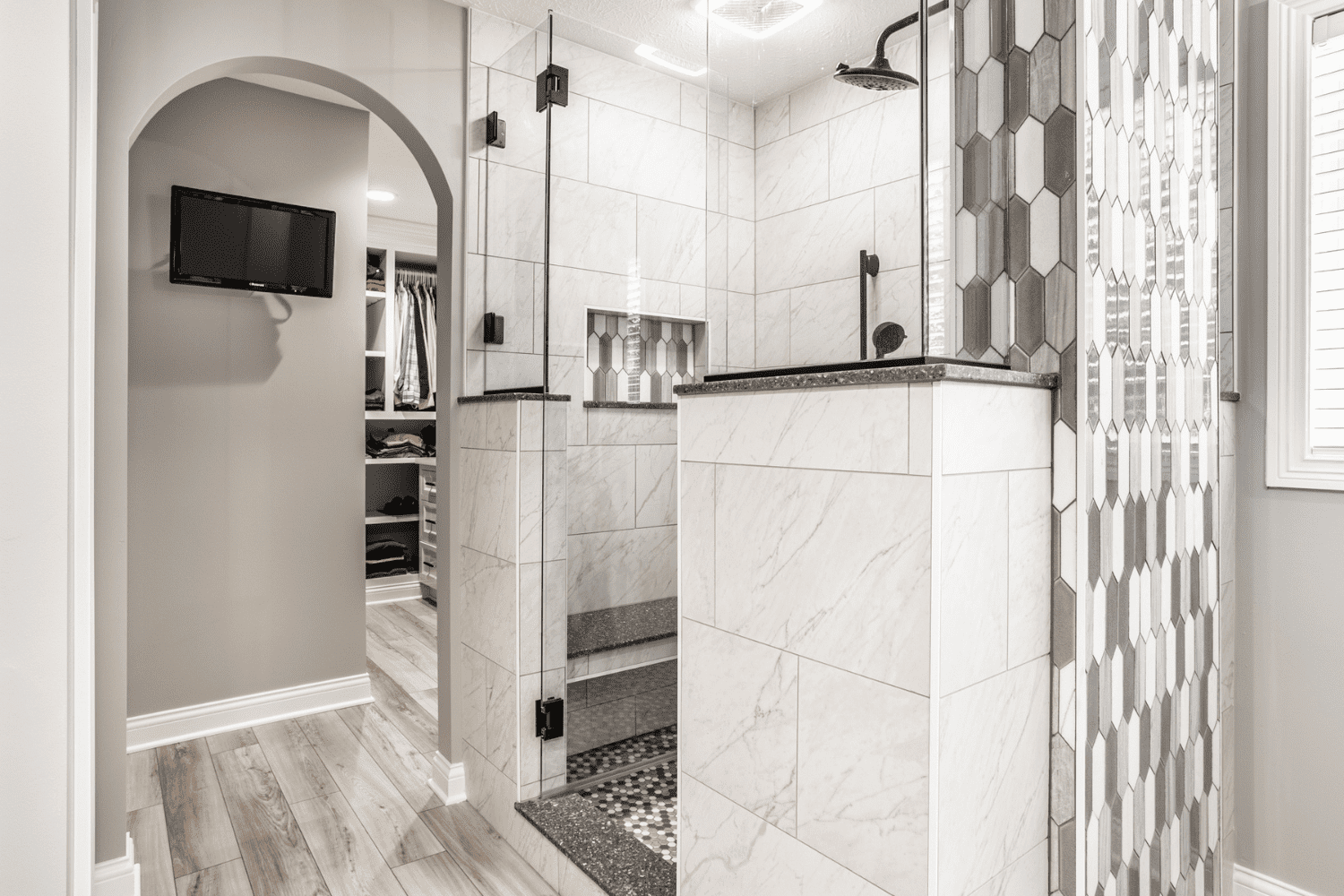 Nicholas Design Build | A white and gray bathroom with a walk in shower.