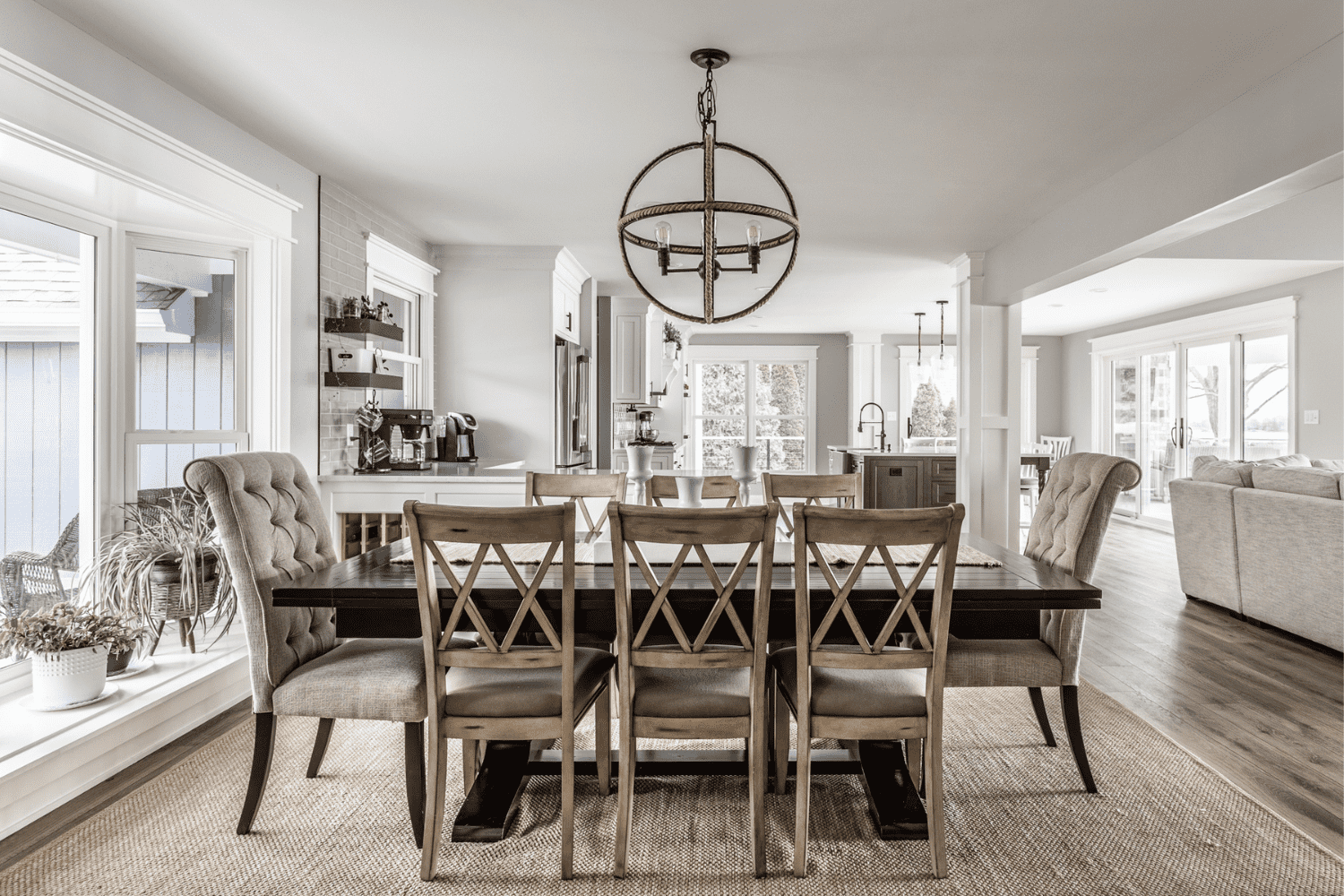 Nicholas Design Build | A dining room with a large table and chairs.