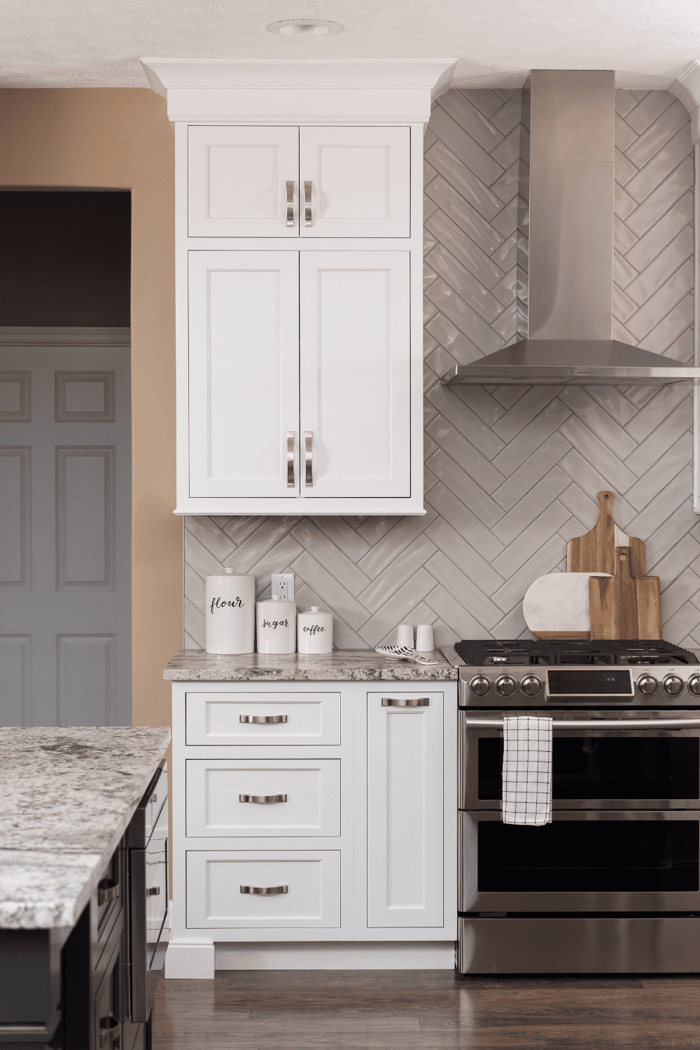 Nicholas Design Build | A versatile kitchen with white cabinets and granite counter tops.