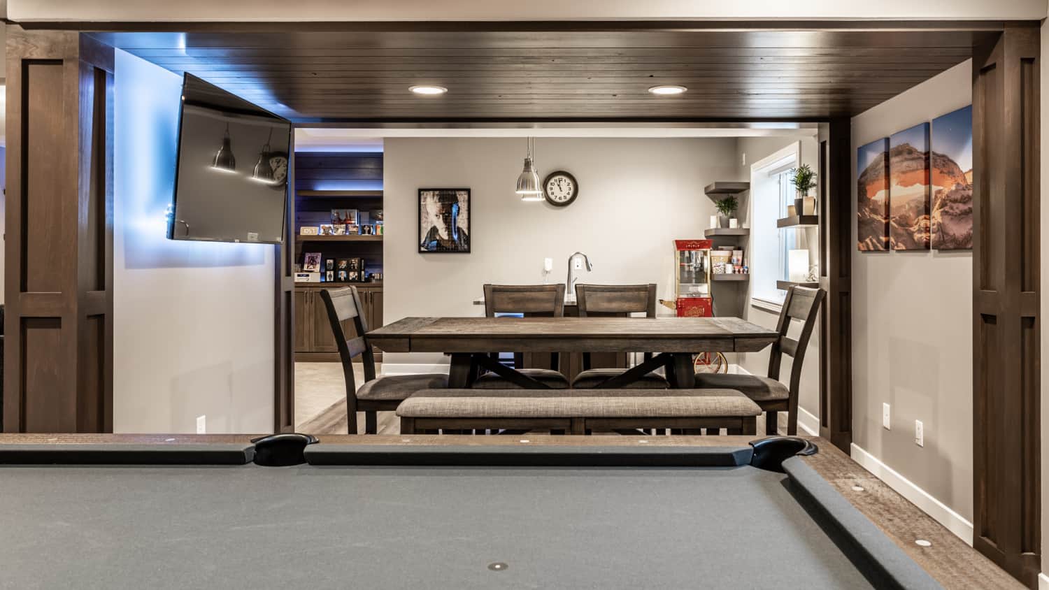 Nicholas Design Build | Remodel the game room with a pool table and a dining table.