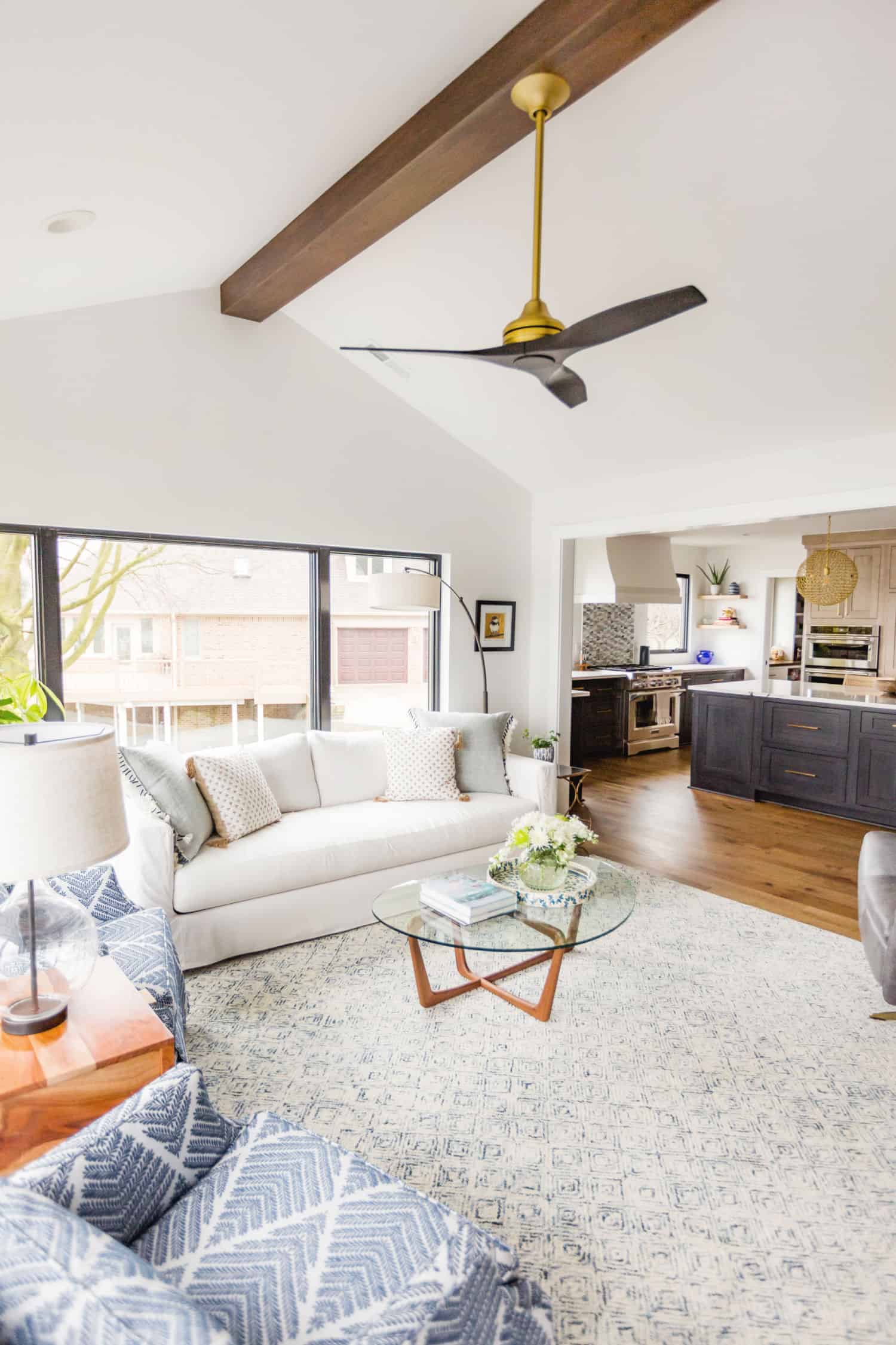Nicholas Design Build | A remodeled white living room with a ceiling fan.