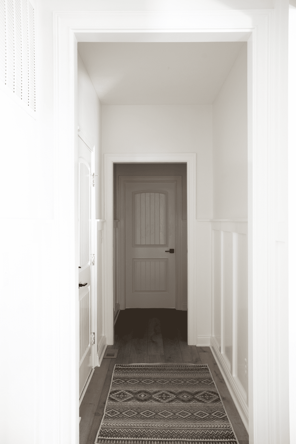 Nicholas Design Build | A black and white photo of a hallway.