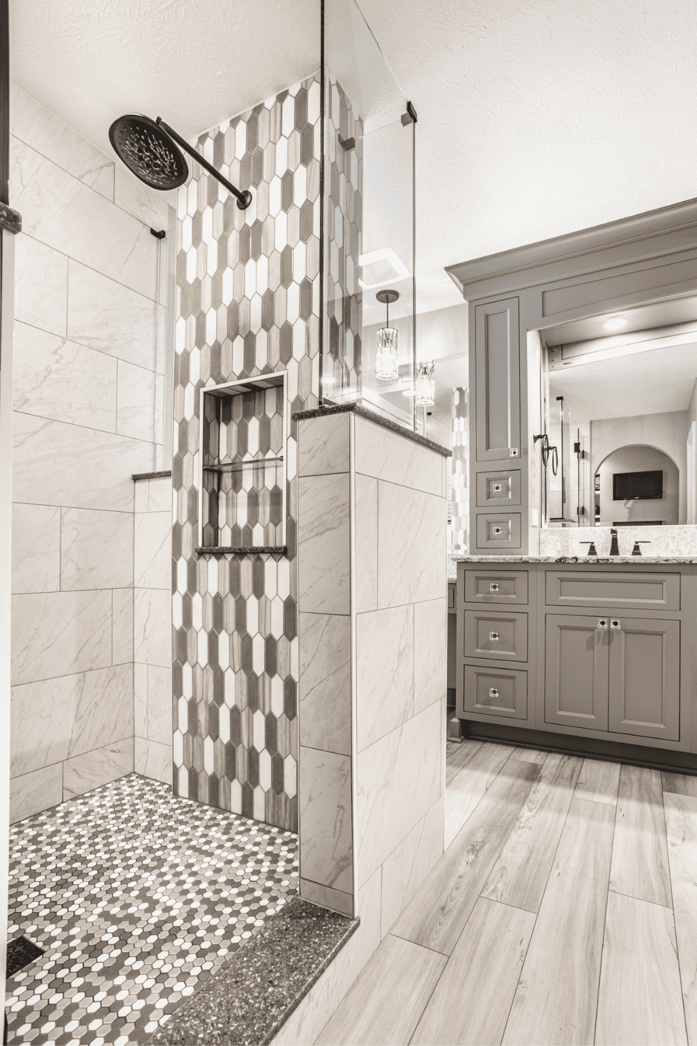 Nicholas Design Build | A black and white photo of a bathroom with a shower.