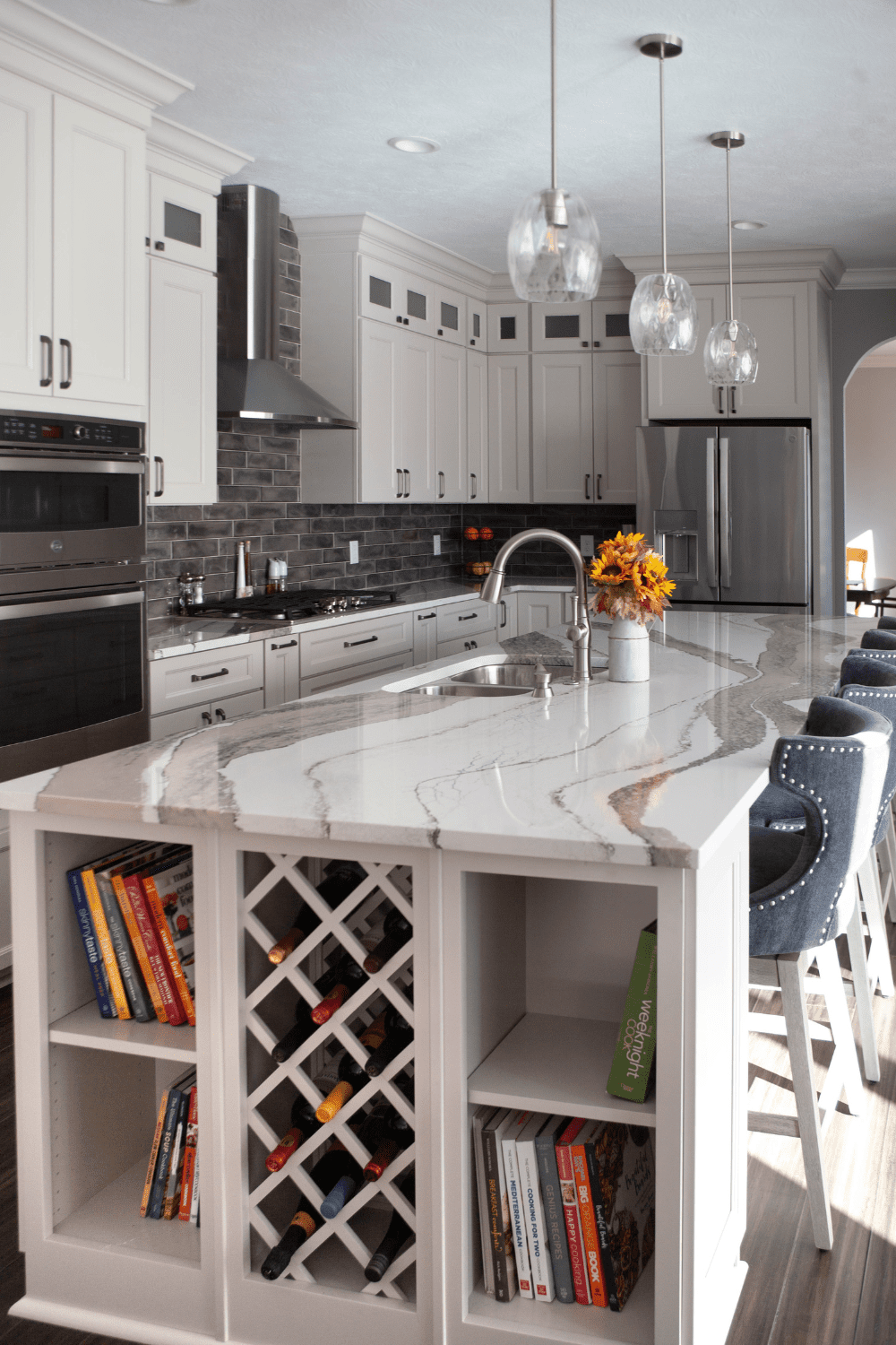 Nicholas Design Build | A white kitchen with a wine rack.