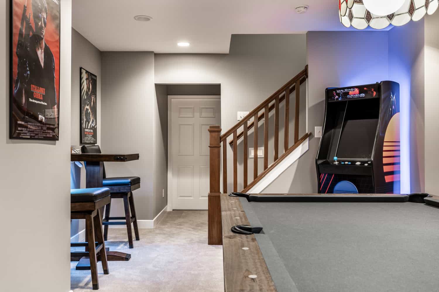 Nicholas Design Build | A remodeled game room with a pool table and a bar.