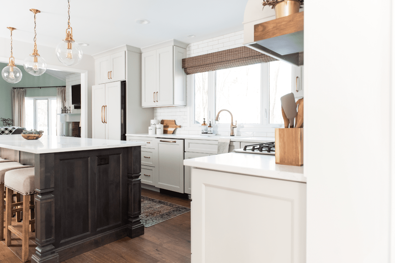 Nicholas Design Build | Neutral kitchen with wood floors and a center island.