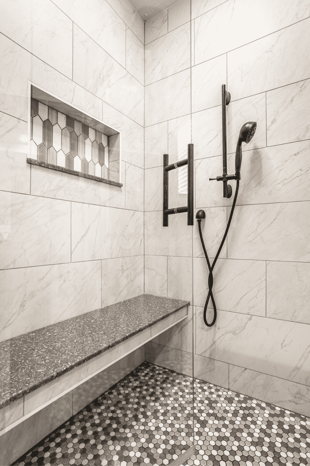 Nicholas Design Build | A black and white photo of a tiled shower.