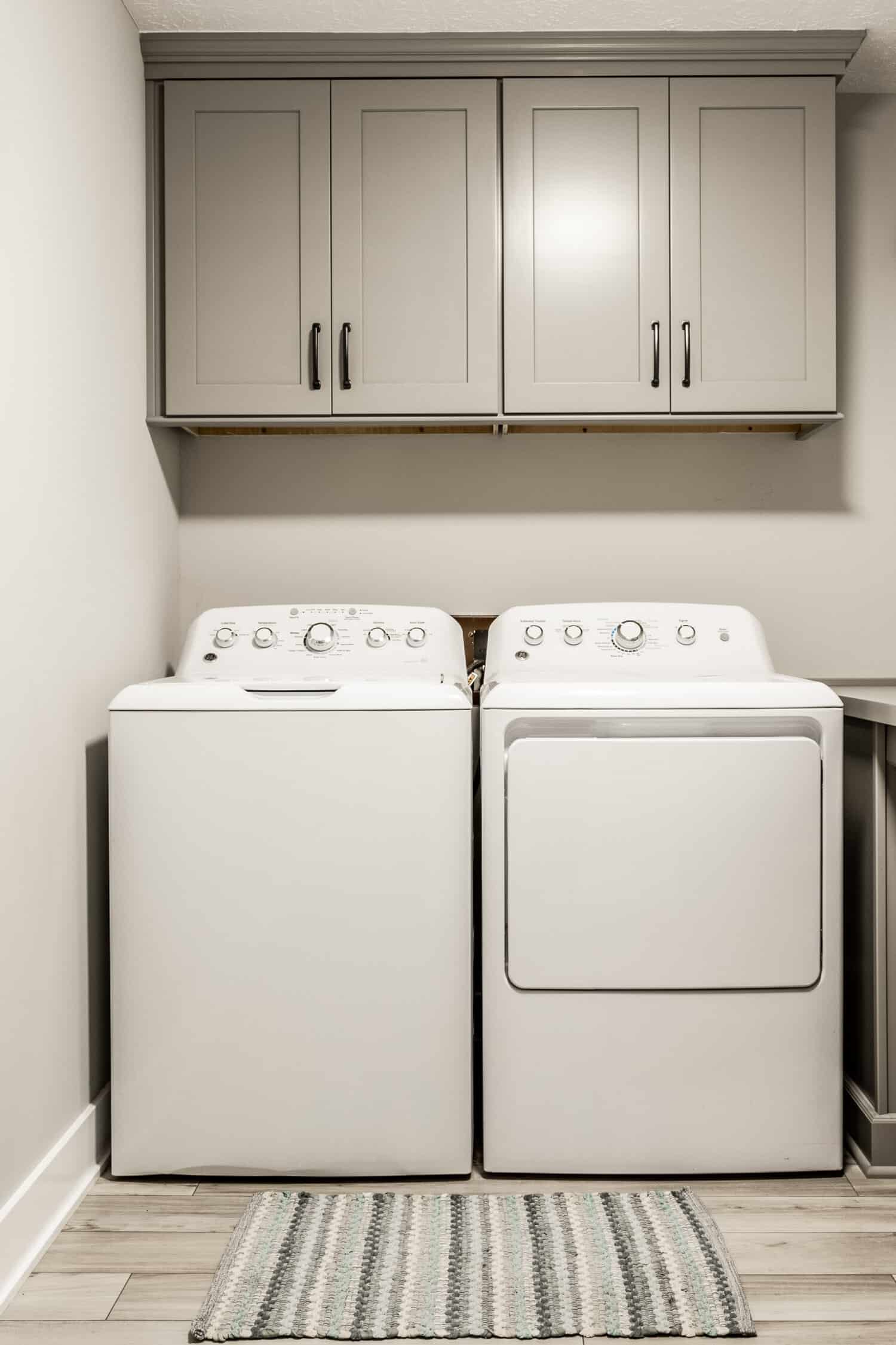 Nicholas Design Build | A remodeled laundry room with a washer and dryer.