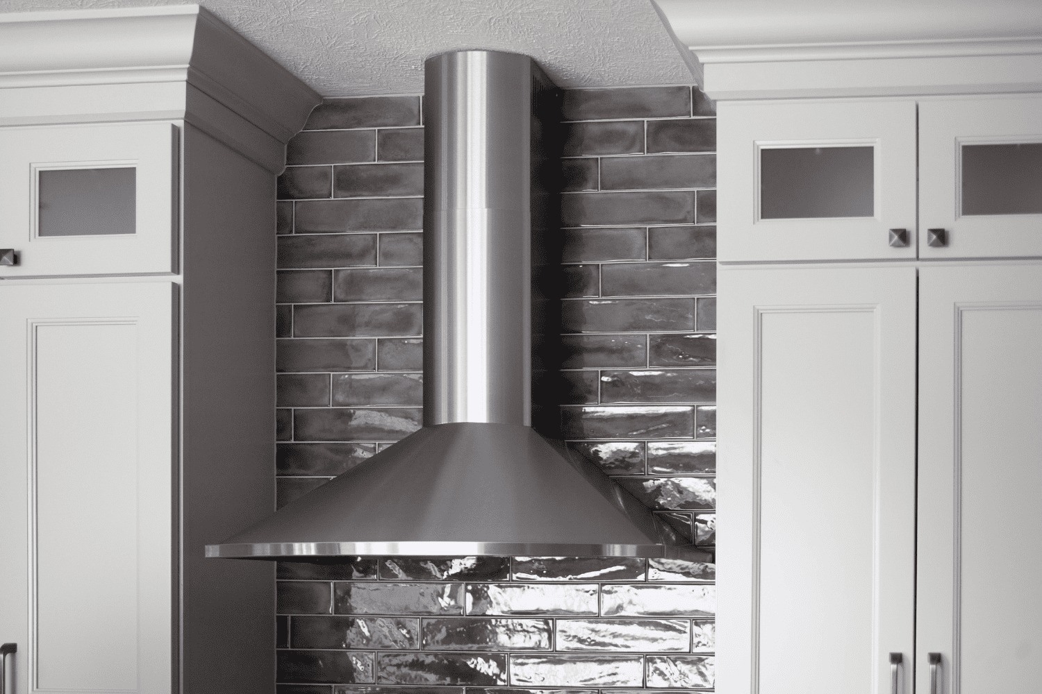 Nicholas Design Build | A kitchen with a stainless steel range hood.
