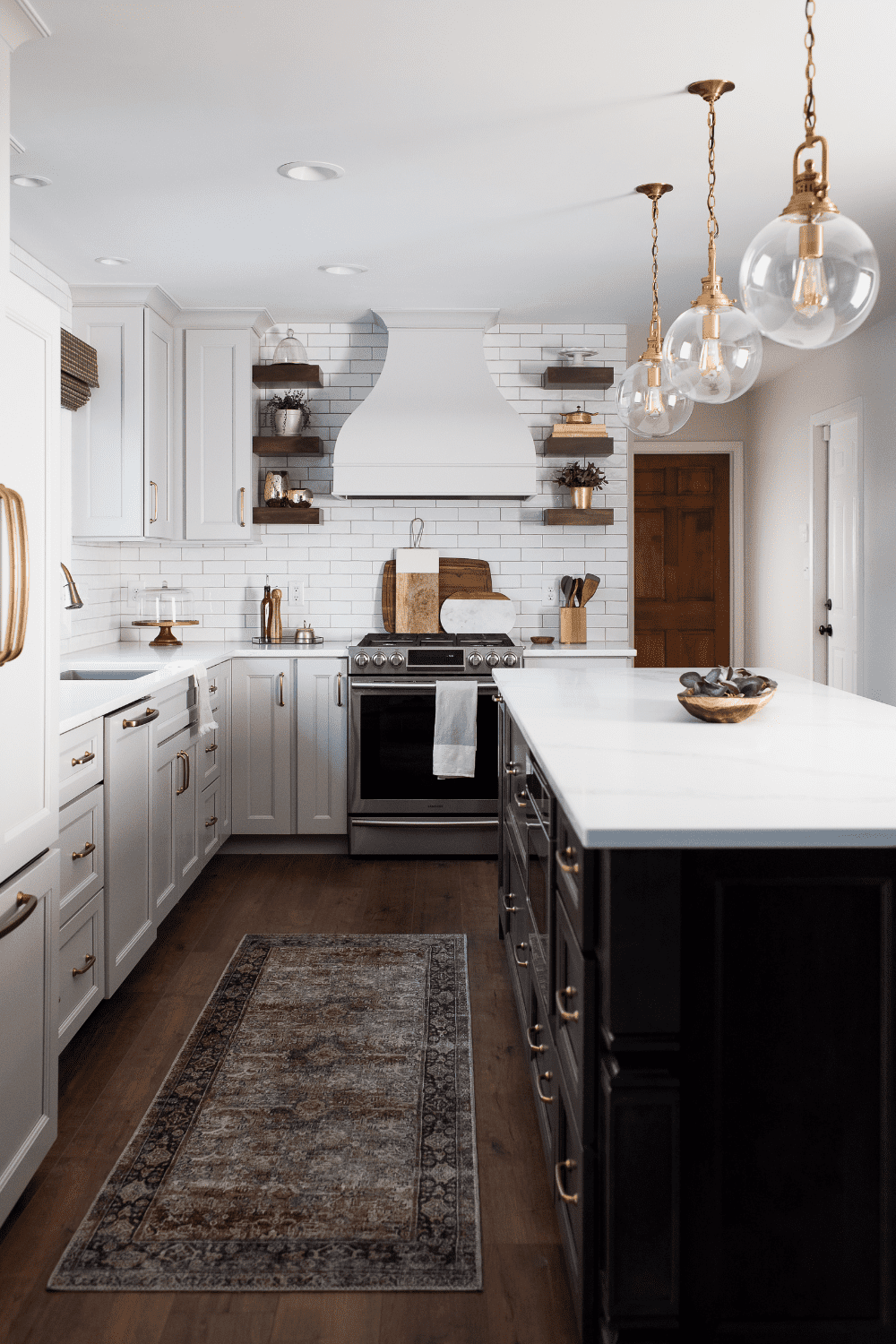 Nicholas Design Build | A neutral kitchen with a rug on the floor.