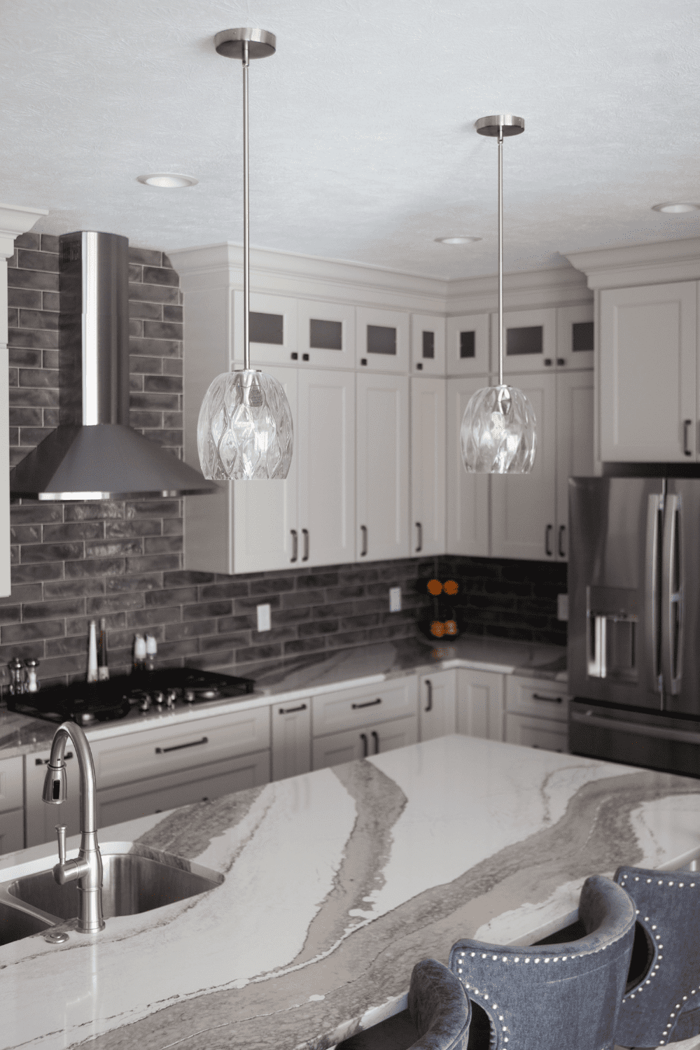 Nicholas Design Build | A kitchen with a marble counter top.
