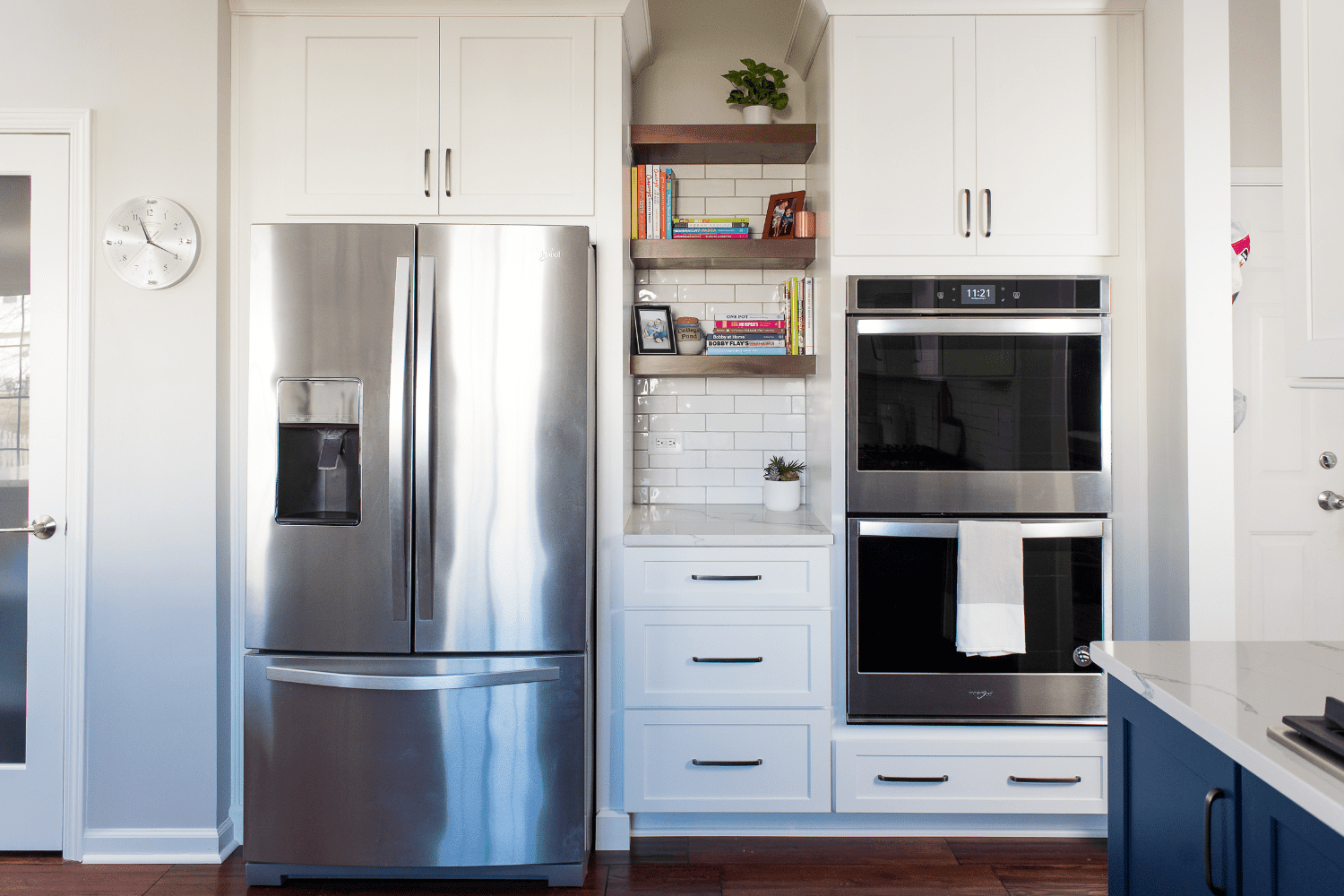 Nicholas Design Build | A stainless steel refrigerator in a kitchen.