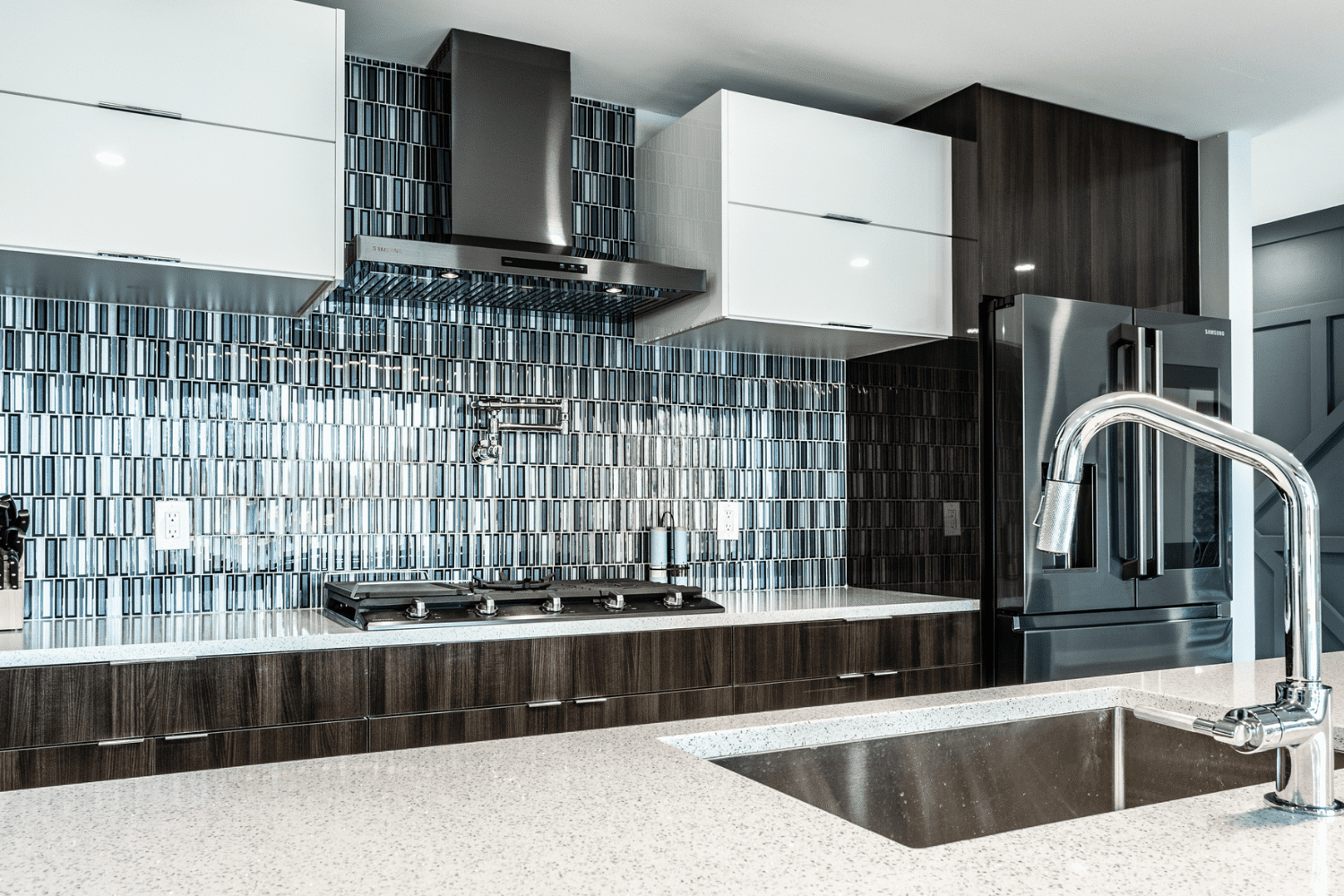 Nicholas Design Build | A stainless steel sink in a modern kitchen.