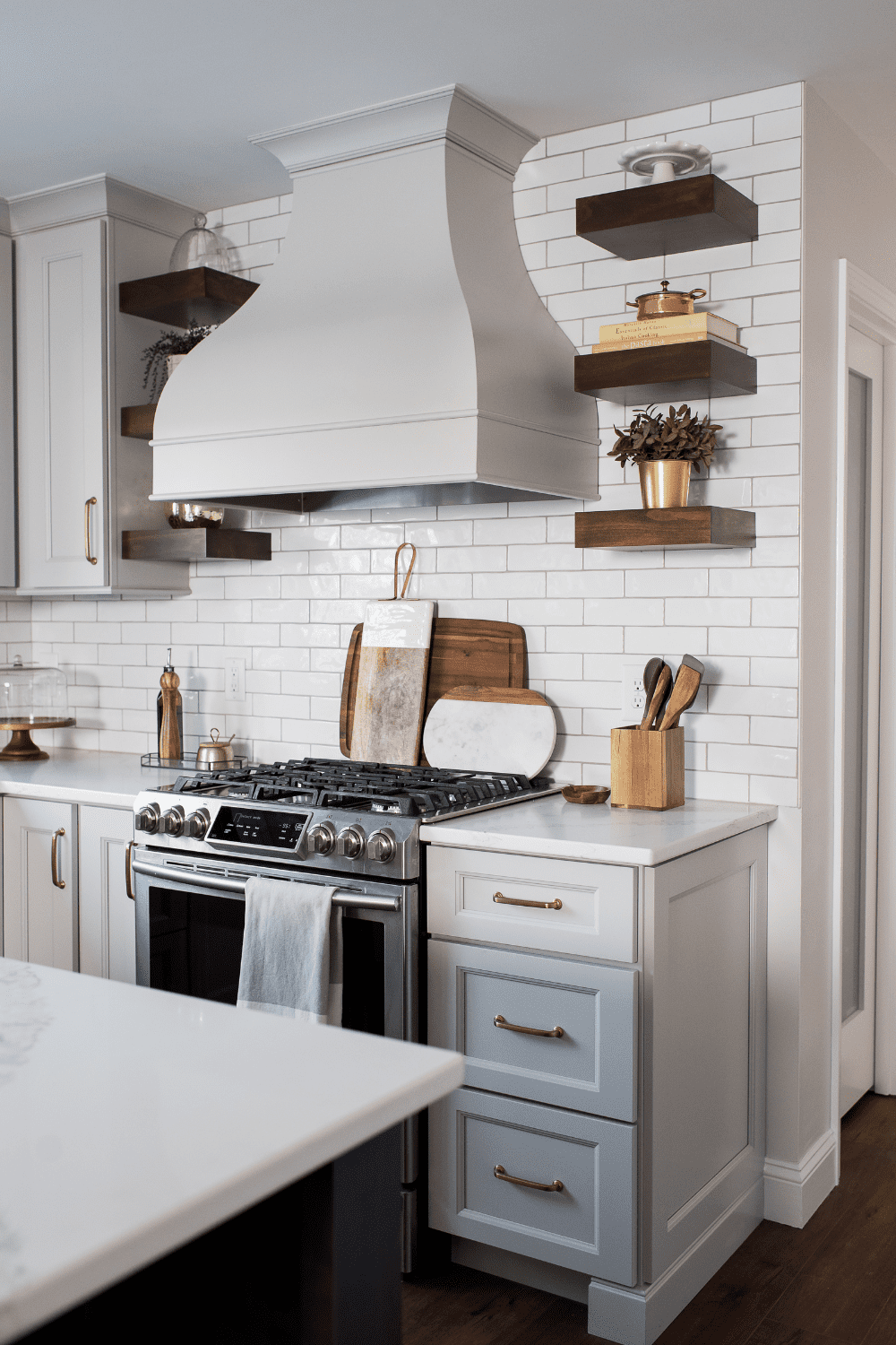Nicholas Design Build | A neutral kitchen with a stove and oven.