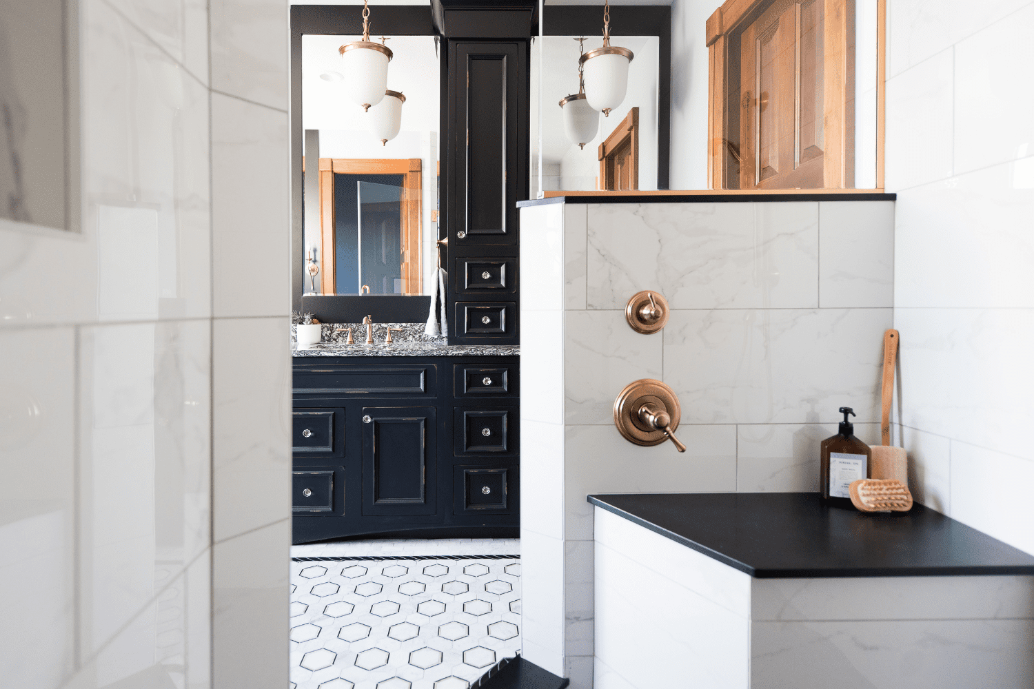 Nicholas Design Build | A bathroom with black and white tile.