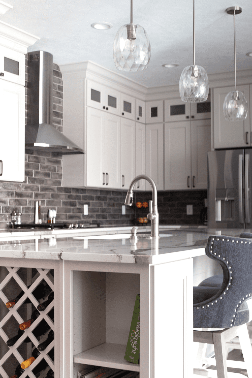 Nicholas Design Build | A white kitchen with a wine rack.