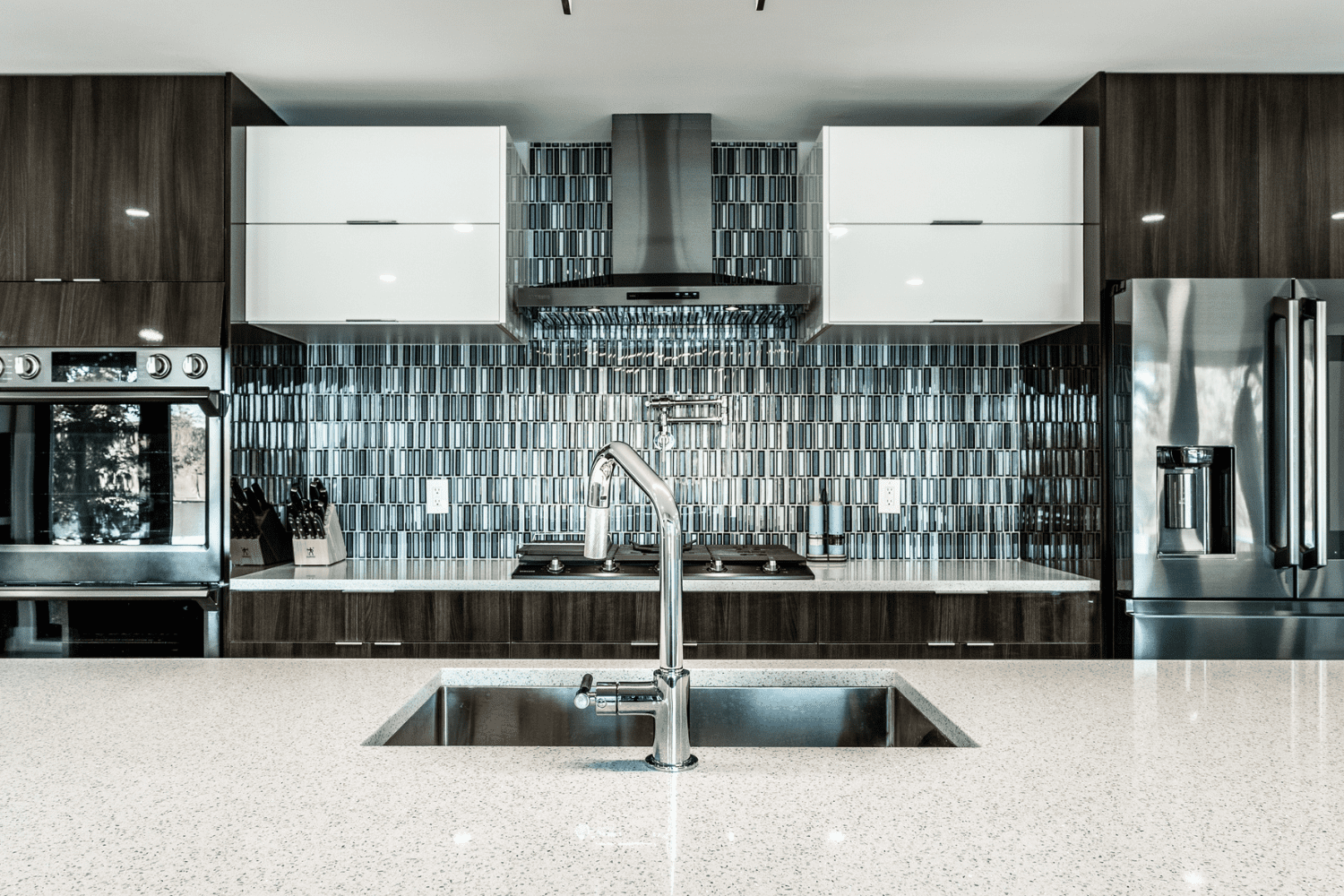 Nicholas Design Build | A modern kitchen with stainless steel appliances.