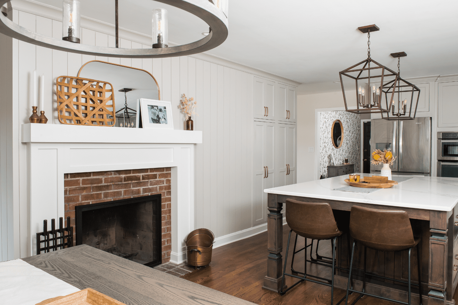 Nicholas Design Build | A kitchen with a large island and a fireplace.