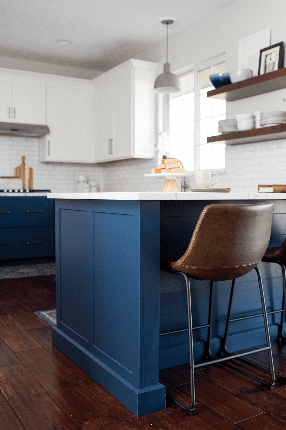 Nicholas Design Build | A kitchen with a blue island.