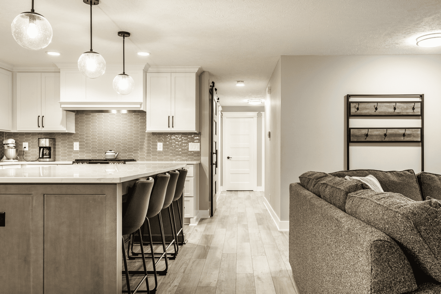 Nicholas Design Build | A black and white photo of a neutral kitchen.