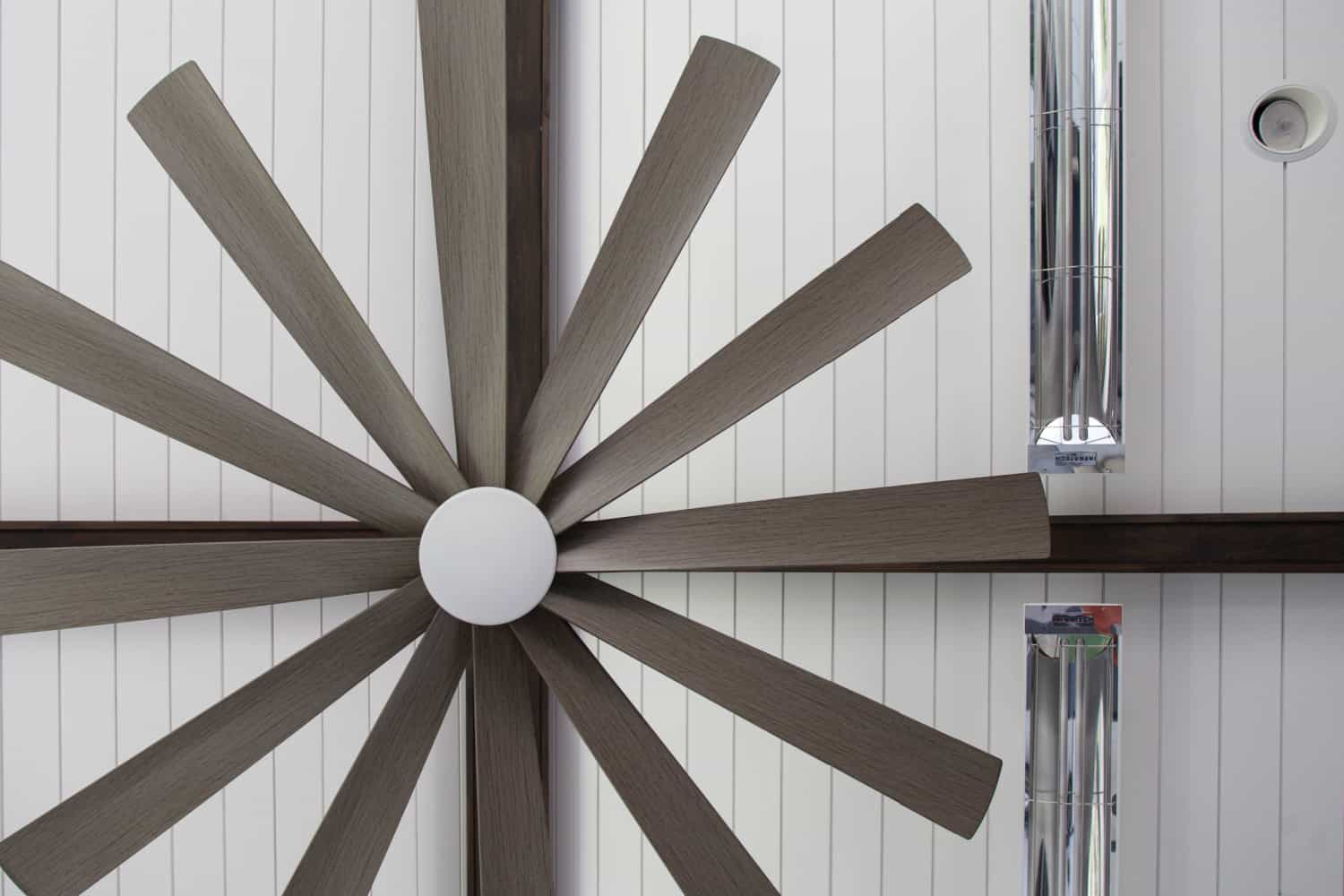 Nicholas Design Build | A large wooden fan on the wall of a room.