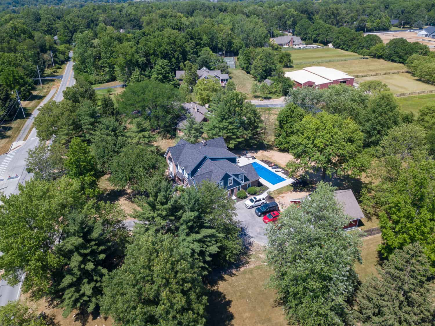 Nicholas Design Build | An aerial view of a remodel home in a wooded area.