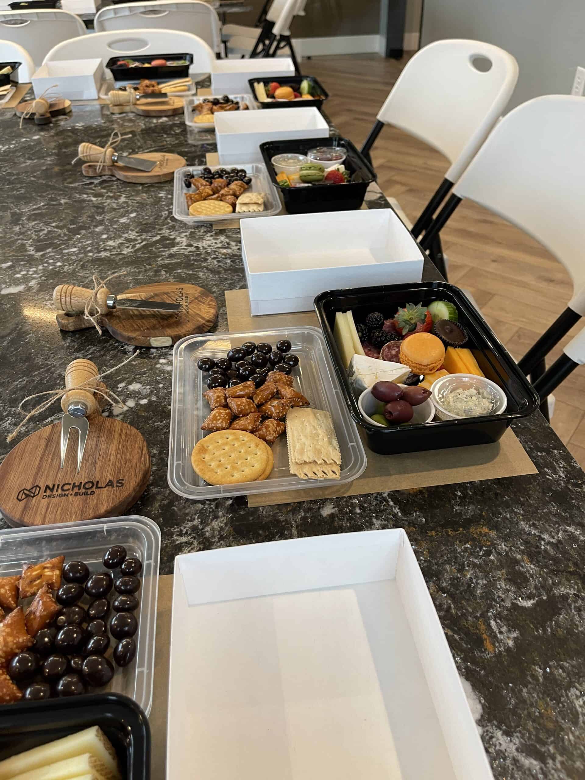 Nicholas Design Build | A table full of cheese and crackers on a table.