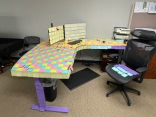 Nicholas Design Build | A desk with sticky notes on it.