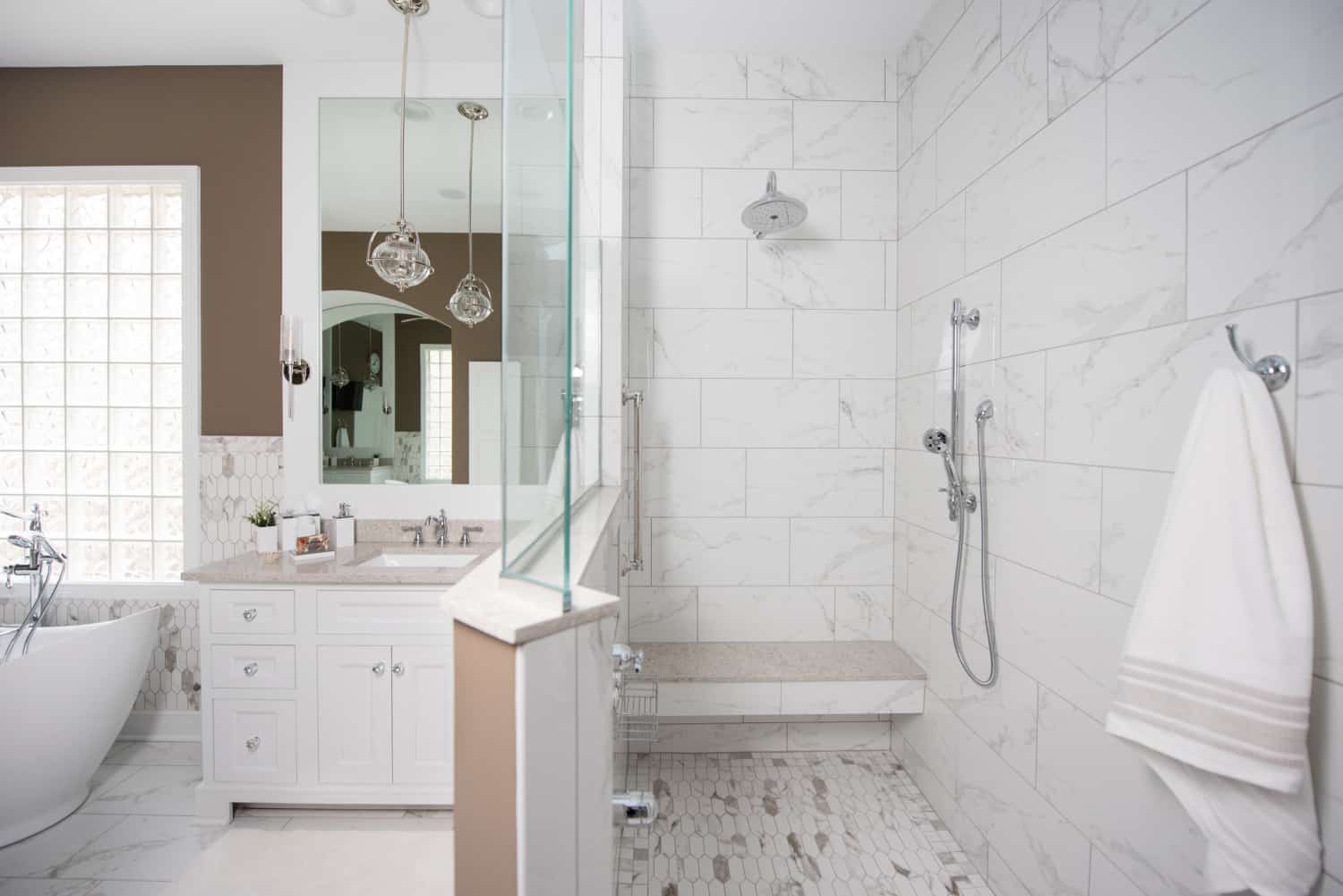 Nicholas Design Build | A white bathroom oasis featuring a walk-in shower.