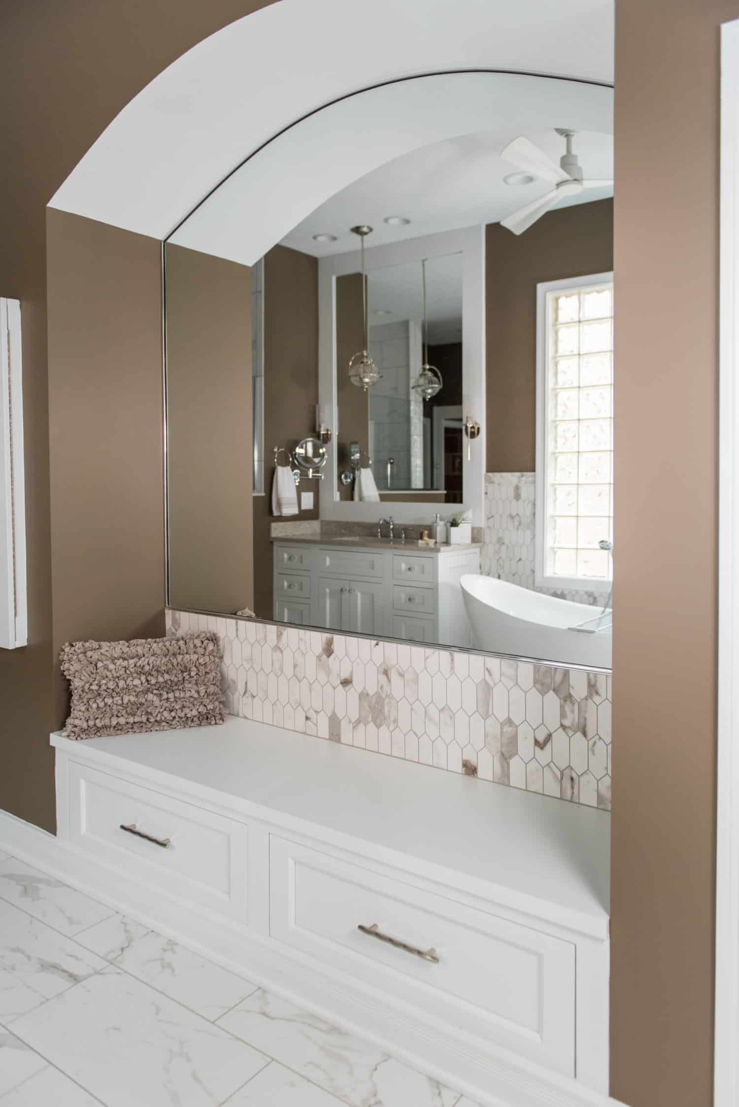 Nicholas Design Build | An oasis of a bathroom with a large mirror and a sink.
