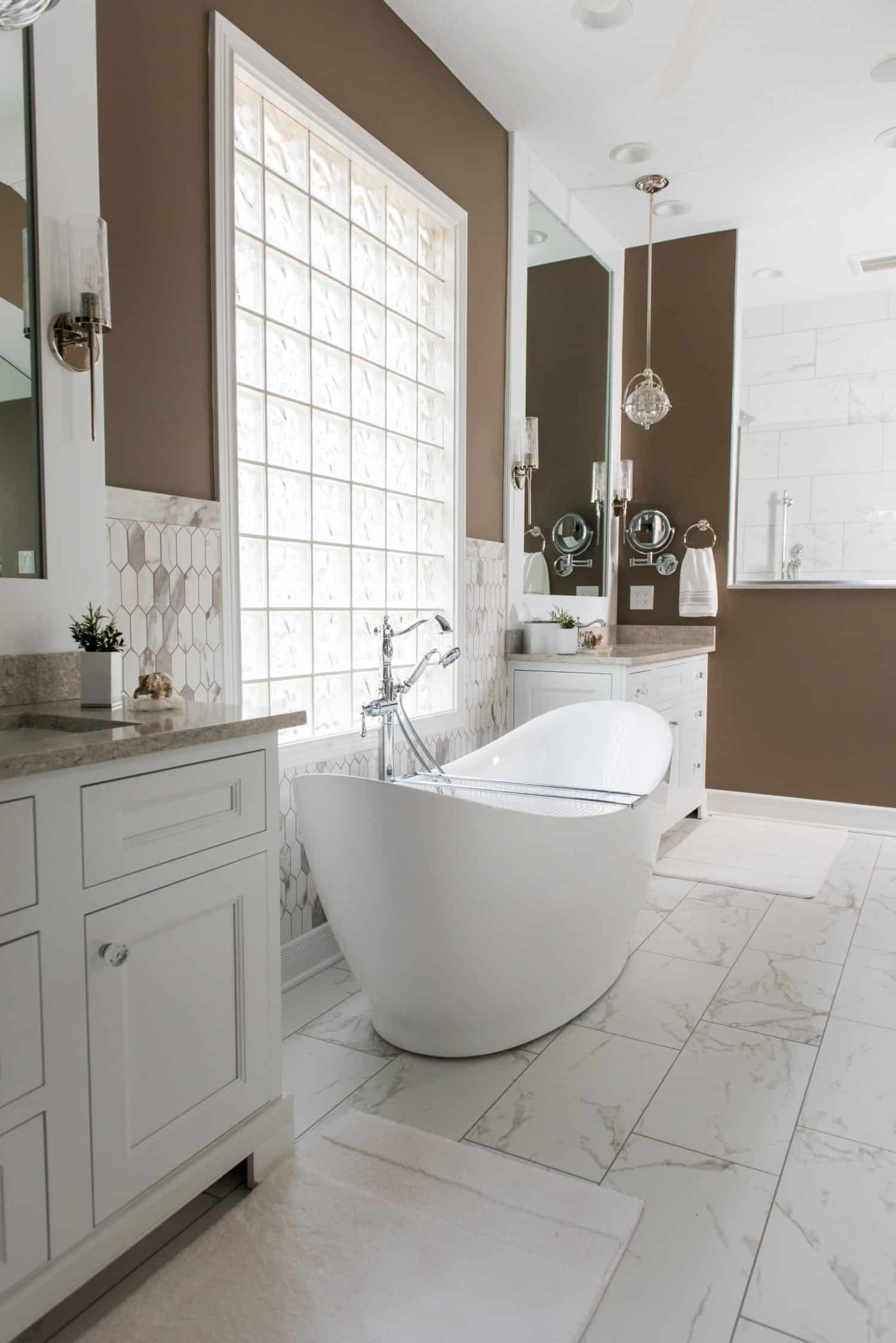 Nicholas Design Build | A white and brown bathroom with a large tub, creating a soothing oasis.