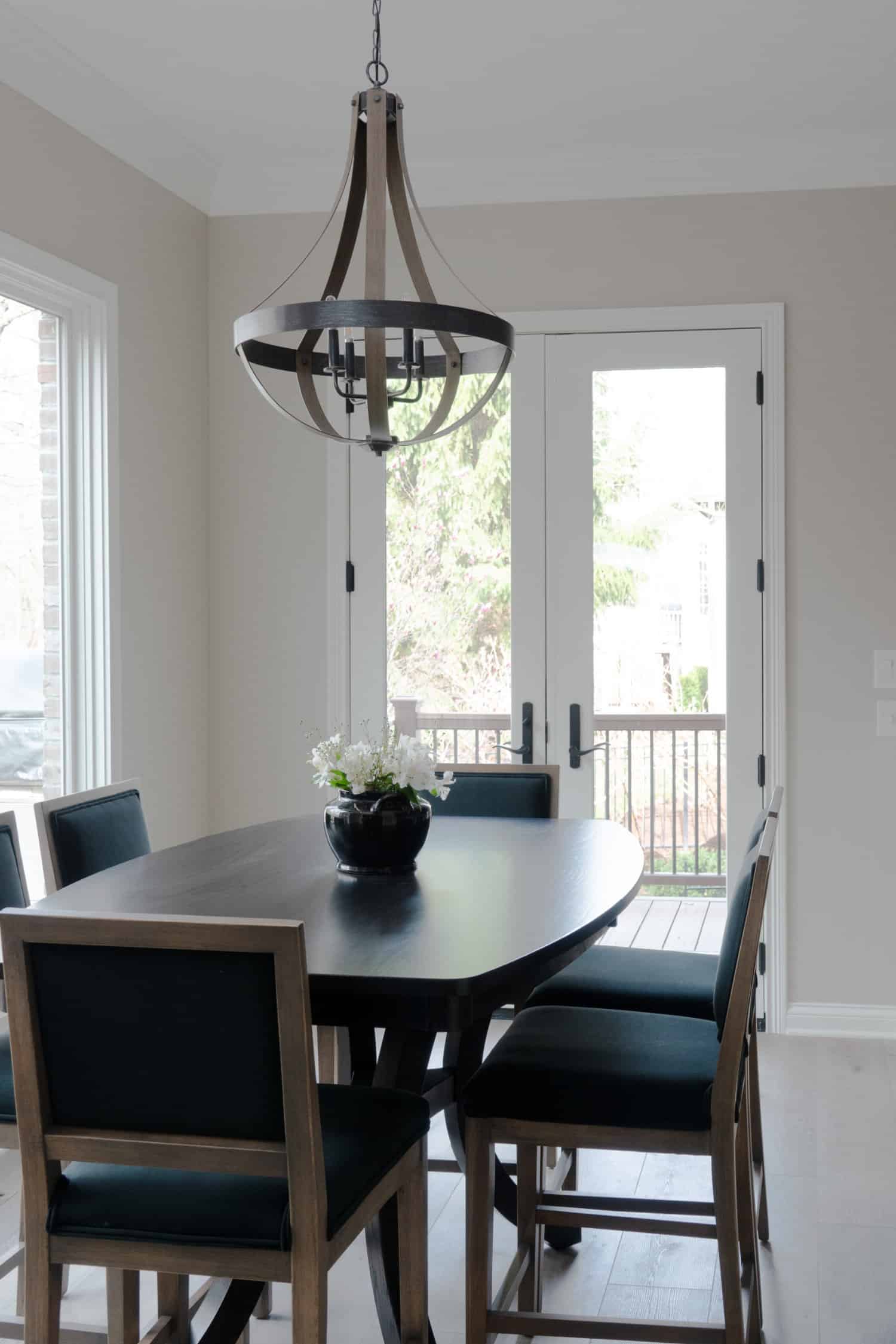 Nicholas Design Build | A remodeled dining room with a table and chairs.