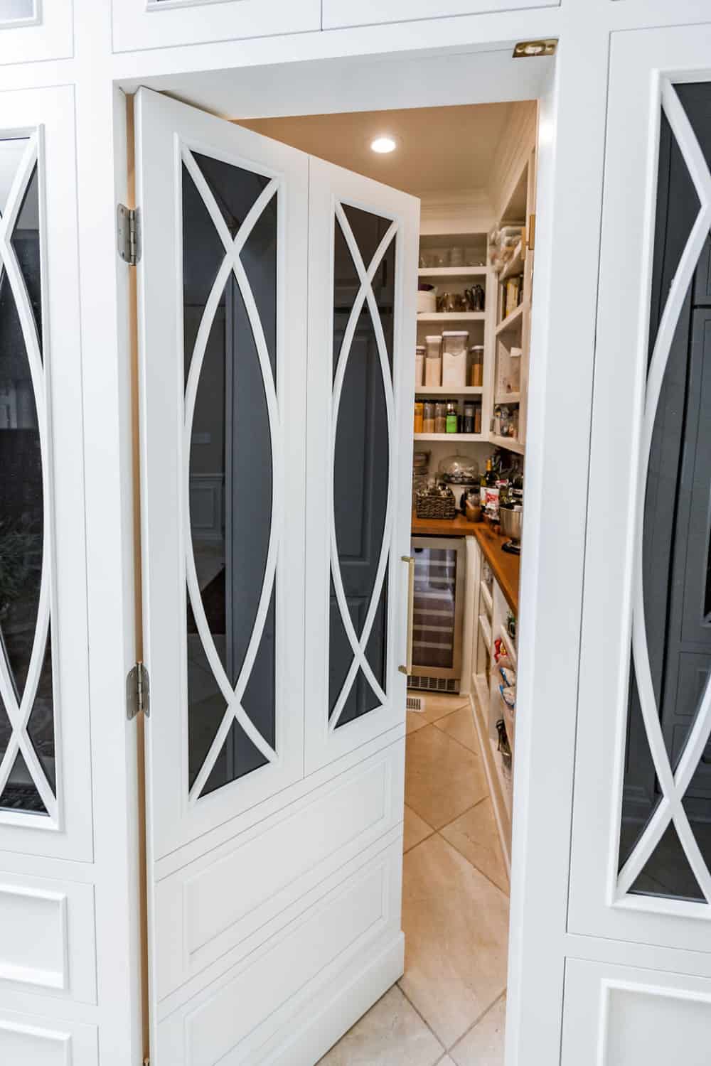 Nicholas Design Build | Remodel a white kitchen door with a glass door.