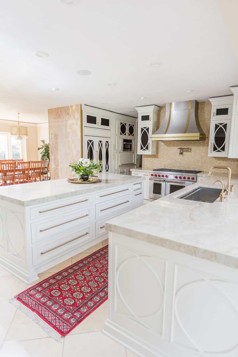 Nicholas Design Build | A spacious kitchen with white cabinets and a stylish rug, perfect for a remodel.