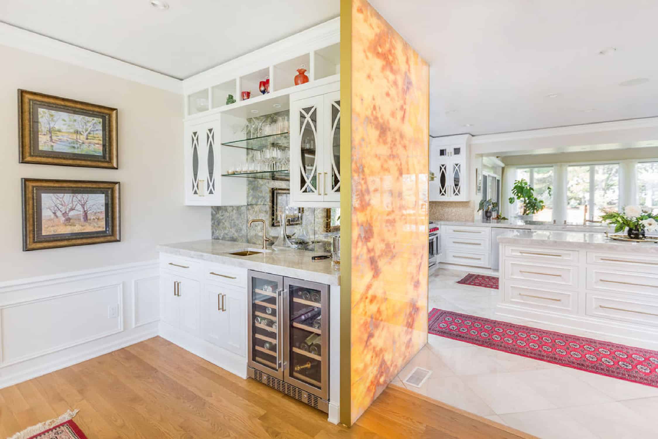 Nicholas Design Build | Remodeling a kitchen to include a door leading to a wine cellar.