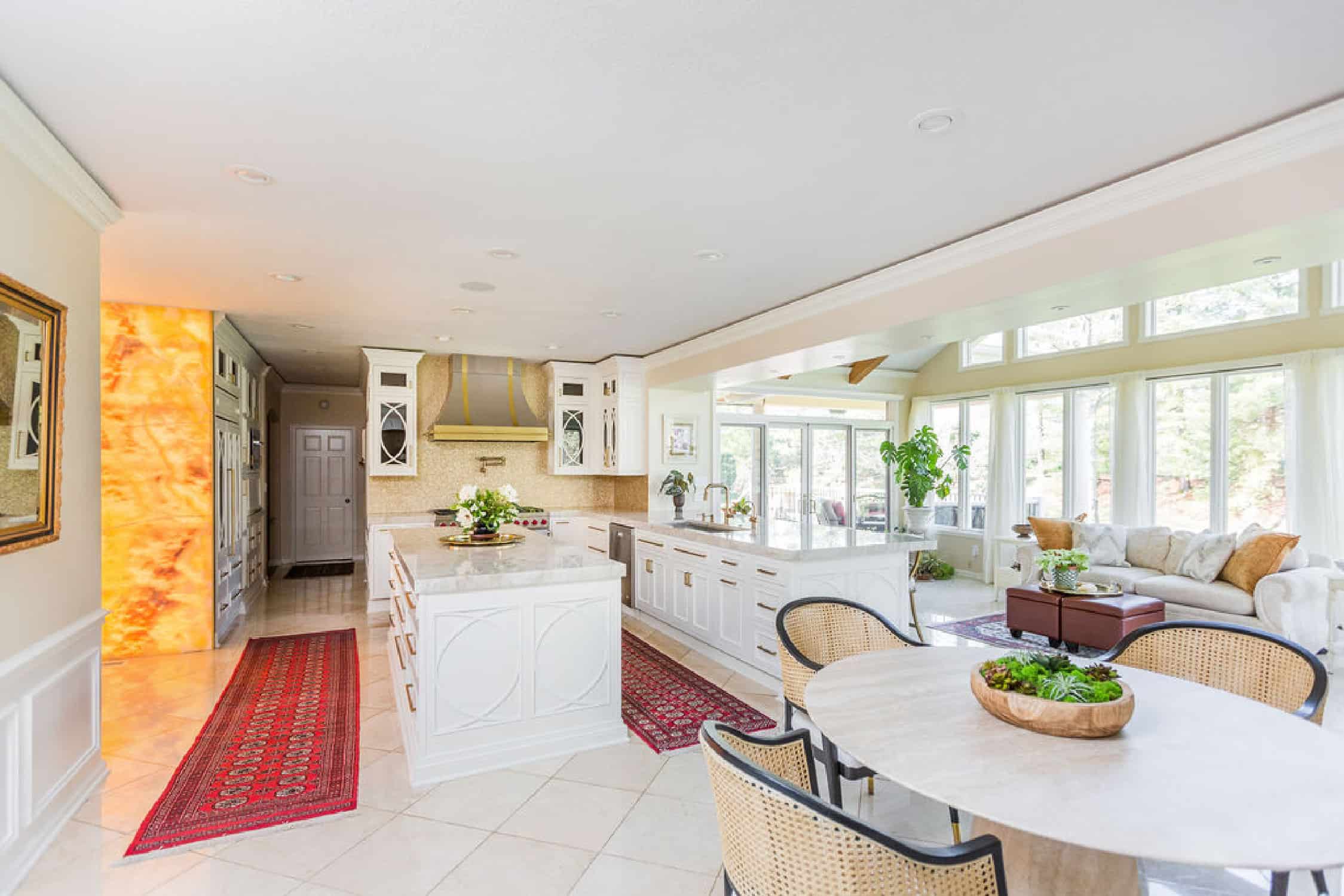 Nicholas Design Build | A large kitchen with a remodeled dining table and chairs.